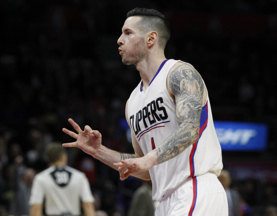 FILE - Los Angeles Clippers guard J.J. Redick celebrates after sinking a 3-point shot late in the second half of an NBA basketball game against the New York Knicks in Los Angeles, in this Friday, March 11, 2016, file photo. Redick announced his retirement from basketball Tuesday, Sept. 21, 2021, ending a 15-season NBA career that came after he was the AP’s college player of the year at Duke in 2006. (AP Photo/Alex Gallardo)