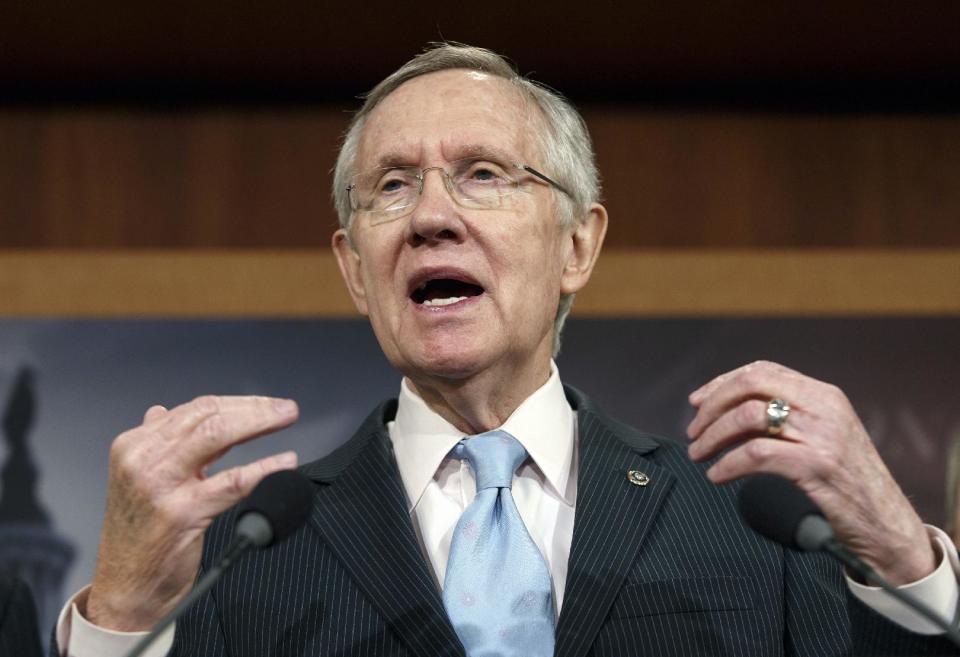 In this Feb. 6, 2014, photo Senate Majority Leader Harry Reid, D-Nev., speaks at the Capitol in Washington, Thursday, Feb. 6, 2014. The road the country has been on for the past five years is now beginning to come to an end. The Federal Reserve is withdrawing its financial lifeline amid signs of fresh economic growth. The nation’s gross domestic product is inching up and annual federal budget deficits are heading down. How Washington policymakers respond to the improvements in the economy may even sow the seeds for more cooperation in Washington. Reid says "We cannot have a country that's paralyzed because of a group of people _ the group of people who are the tea party-driven Republicans in Congress." (AP Photo/J. Scott Applewhite)