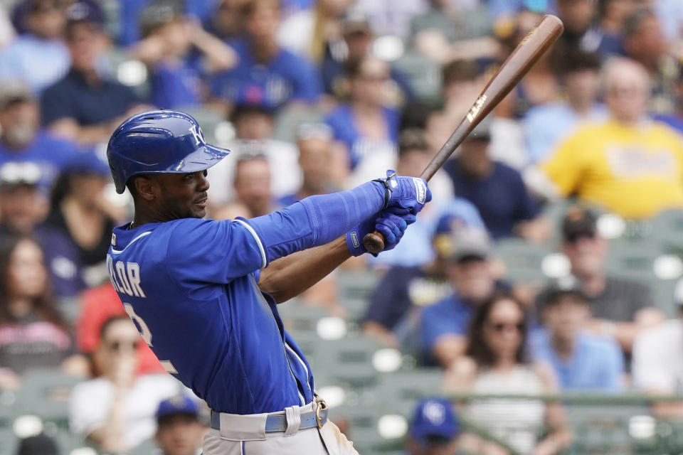 Kansas City Royals' Michael A. Taylor hits a sacrifice fly during the eighth inning of the team's baseball game against the Milwaukee Brewers, Tuesday, July 20, 2021, in Milwaukee. (AP Photo/Nam Y. Huh)