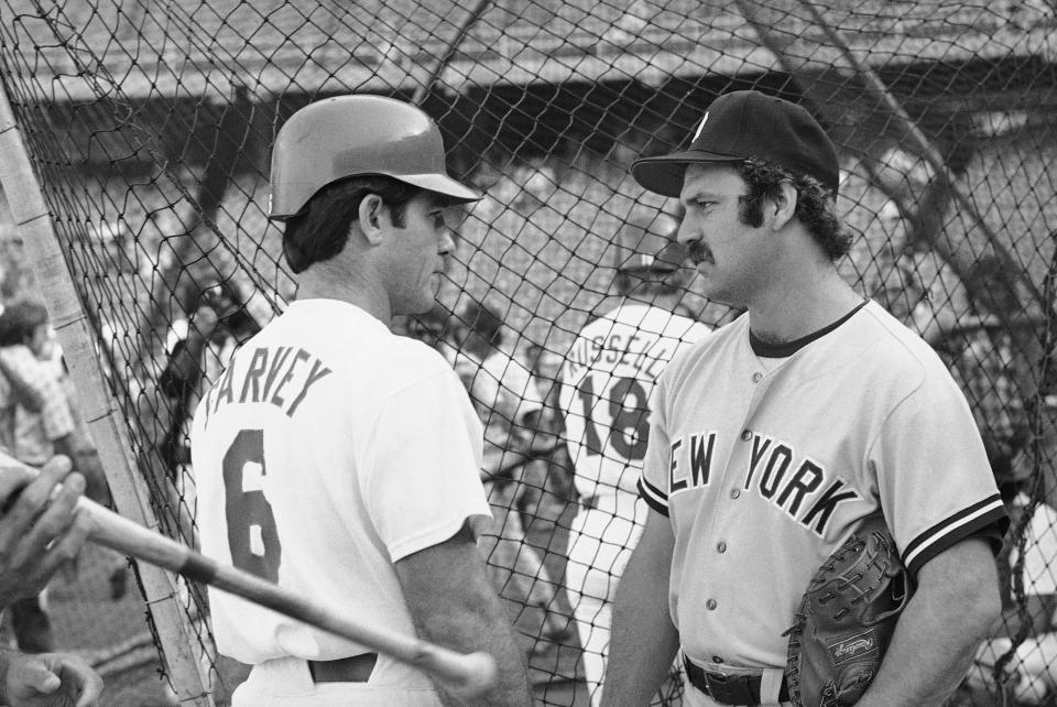 Dodgers first baseman Steve Garvey, left, and Yankees catcher Thurman Munson have a pregame talk at the batting cage, Oct. 10, 1978 in Los Angeles before the start of the World Series.