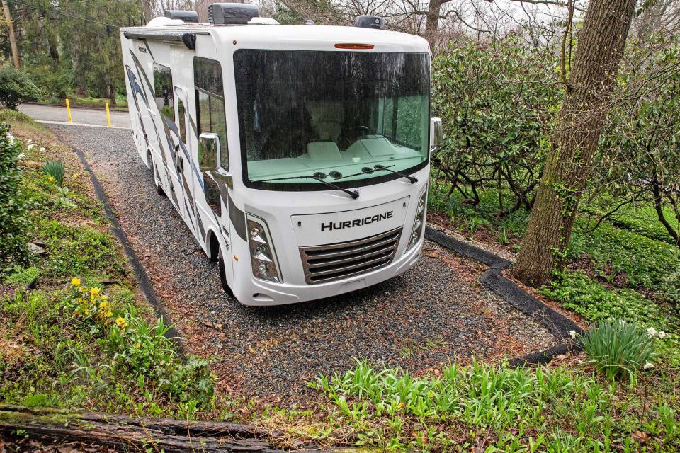 Homeowner and resident Amanda Clappsy’s RV is featured with the bollards recently installed to block her driveway and RV in the background at the Westminster community on Tuesday, April 2, 2024. Clappsy, after clearing with the community’s prior board, reconfigured her driveway so she could park her RV but has been having problems with the new civic association board due to her RV.