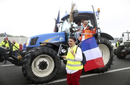 Harbor workers, truck drivers, farmers, storekeepers and residents attend a protest demonstration on the motorway against the migrant situation in Calais, France, September 5, 2016. REUTERS/Charles Platiau