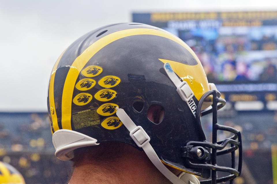 Michigan offensive lineman Ben Braden (71) wears his helmet during warmups before an NCAA college football game against UNLV in Ann Arbor, Mich., Saturday, Sept. 19, 2015. (AP Photo/Tony Ding)