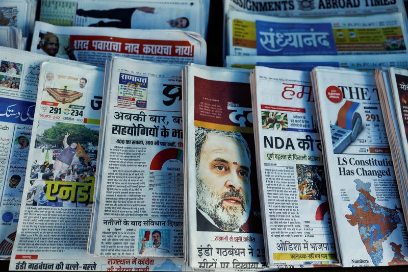 Newspapers are displayed at a stall following the results of India's general election, in Mumbai