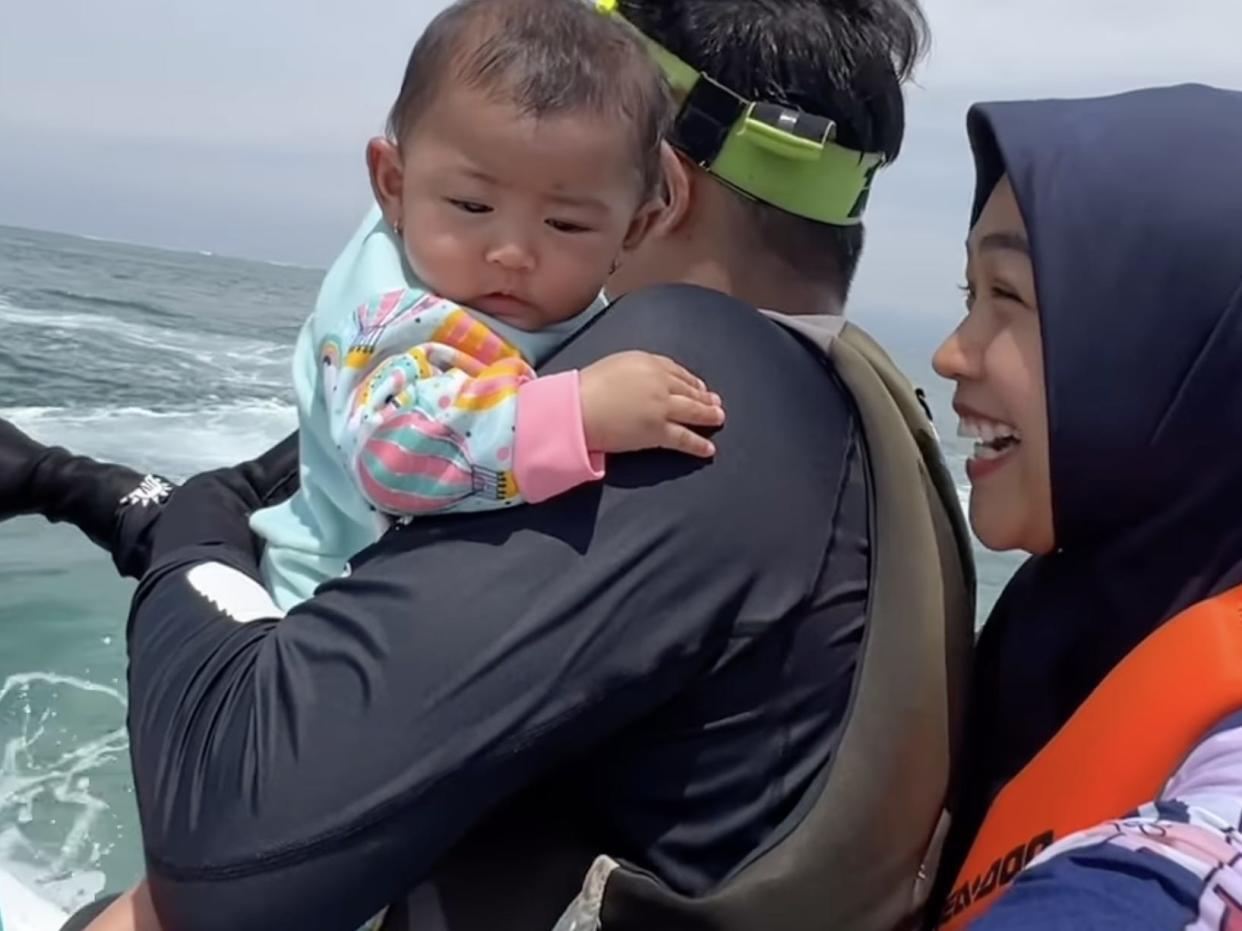 family on jet ski including baby without life jackets