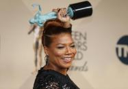 Queen Latifah holds the award for Outstanding Performance by a Female Actor in a Television Movie or Miniseries for her role in "Bessie" as she poses backstage at the 22nd Screen Actors Guild Awards in Los Angeles, California January 30, 2016. REUTERS/Mike Blake