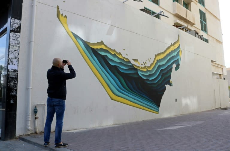 A graffiti by Tunisian street artist The Inkman is seen on a wall of 2nd of December street, part of the government-funded Dubai Street Museum project