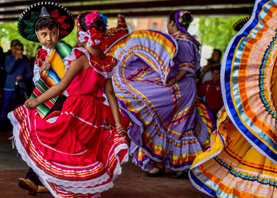 Christian Gonzalez, 9, and Jayliah Villa, 7 perform Mexican folk dance with Baile Folklorico Raices Mexicanas in Passaic, New Jersey, on Cinco de Mayo May 5, 2019.