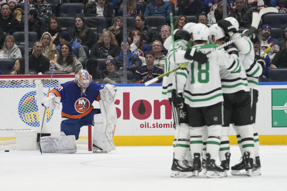 New York Islanders goaltender Ilya Sorokin (30) reacts as the Dallas Stars celebrate after defenseman Nils Lundkvist scored during the second period of an NHL hockey game Sunday, Jan. 21, 2024, in Elmont, N.Y. (AP Photo/Mary Altaffer)