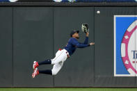 Minnesota Twins center fielder Byron Buxton makes a diving catch for the out on a fly ball hit by Detroit Tigers' Javier Candelario during the fourth inning of a baseball game Tuesday, May 24, 2022, in Minneapolis. (AP Photo/Craig Lassig)