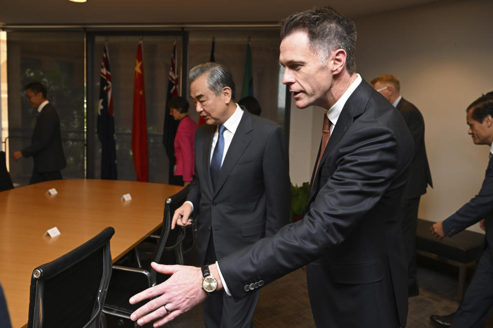 Chinese Foreign Minister Wang Yi, center, meets with New South Wales state Premier Chris Minns during a visit to New South Wales Parliament House in Sydney, Thursday, March 21, 2024. Australia received its most senior Chinese leadership visit in nearly seven years with Wang's arrival Wednesday. (Dean Lewins/Pool Photo via AP)