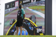 Mark Kellett, father of race driver Dalton Kellett, of Canada, watches the race in front of a video screen during the IndyCar auto race at Indianapolis Motor Speedway in Indianapolis, Saturday, July 4, 2020. The race was run without fans due to the coronavirus pandemic. (AP Photo/Darron Cummings)