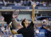 Roger Federer of Switzerland serves to Marinko Matosevic of Australia during their first round men's single match at the 2014 U.S. Open tennis tournament in New York, August 26, 2014. REUTERS/Shannon Stapleton