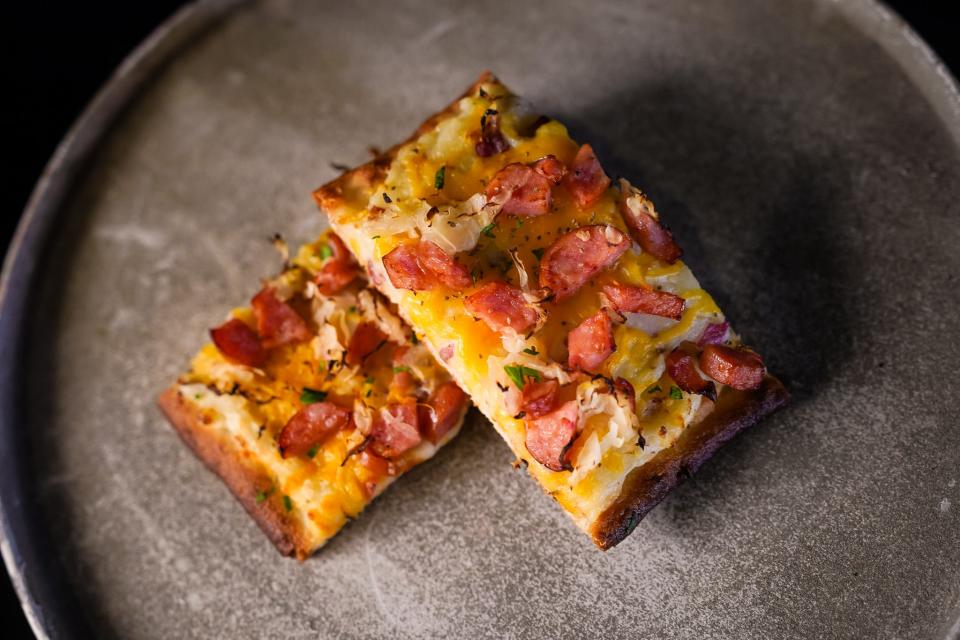 A slice of the new Octoberfest pizza at HalloWeekends at Cedar Point.