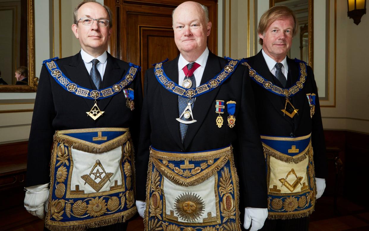 Jonathan Spence, left, with fellow Freemasons Peter Lowndes and Sir David Wootton