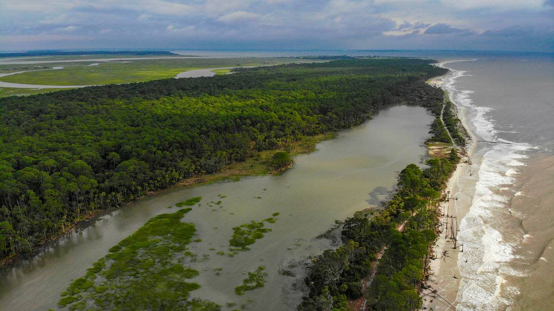 Looking north with the Harbor Island Bridge at the top of the photo, South Carolina’s Hunting Island State Park beaches, right, are only a sliver at high tide as seen on Aug. 4, 2023.