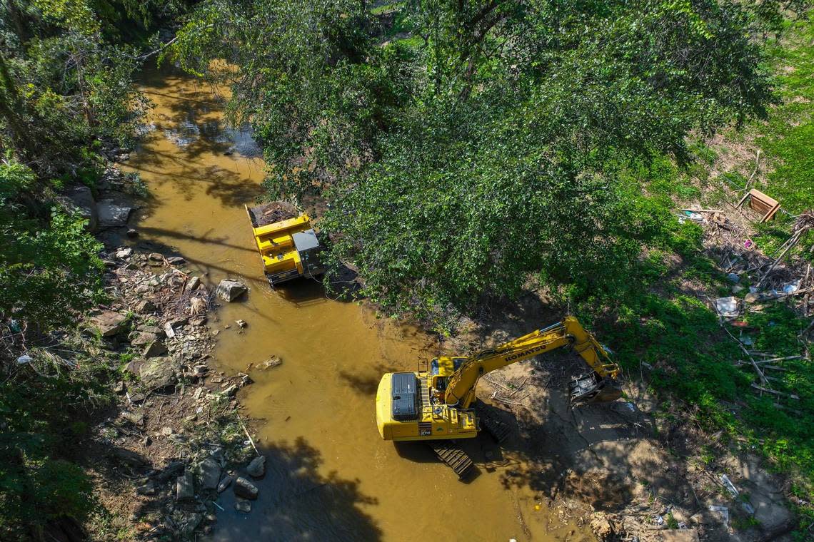 Crews work to remove debris from Troublesome Creek in Perry County, Ky., on Tuesday, Aug. 23, 2022.