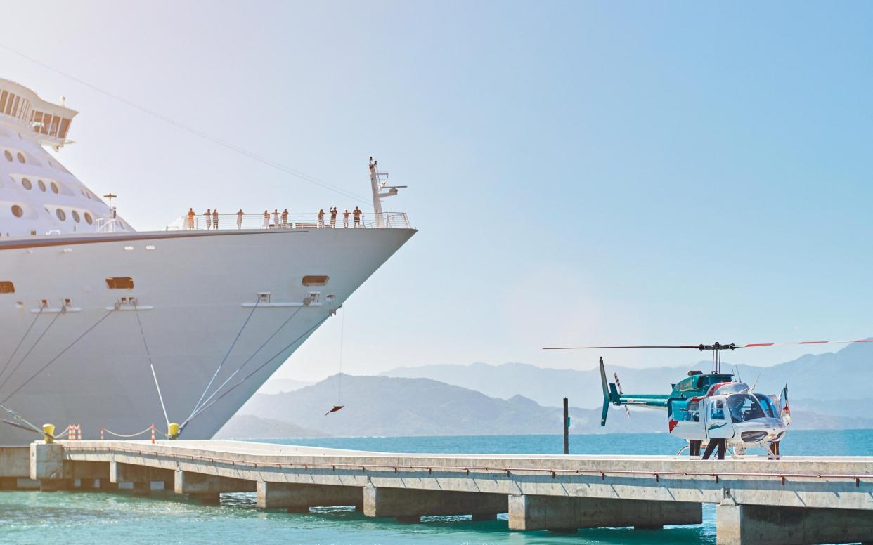 helicopter take off from emergency in cruise ship on pier