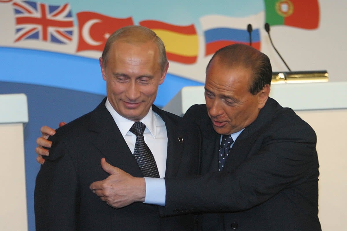 Russian president Vladimir Putin and Berlusconi at the Nato summit in Russia in 2002 (AP)
