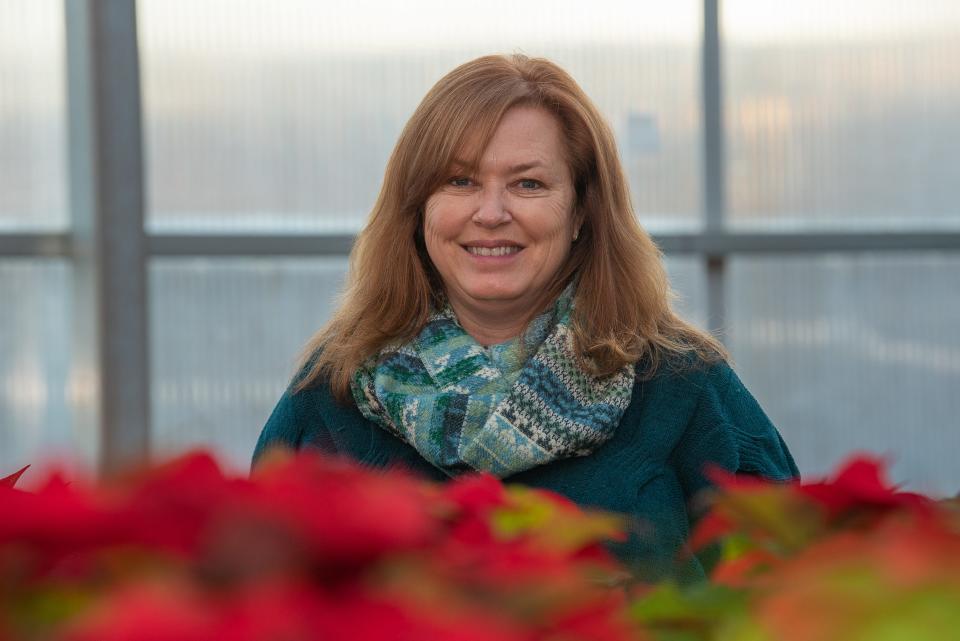 Michelle Provaznik, former executive director of the Gardens at Spring Creek, poses for a portrait Dec. 2 in the Gardens' greenhouse in Fort Collins. After more than 14 years, Provaznik left her role last month to become CEO of the American Public Gardens Association.