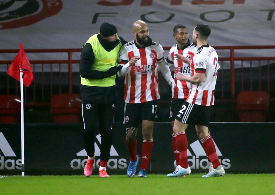 David McGoldrick, centre, celebrates putting Sheffield United in front (PA)