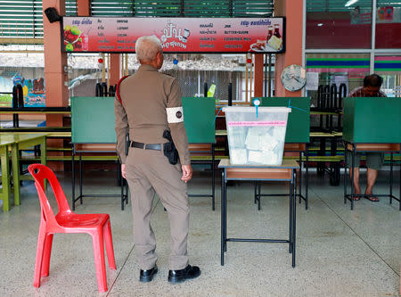 A police officer stands guard during the general election in Bangkok, Thailand, March 24, 2019. REUTERS/Soe Zeya Tun