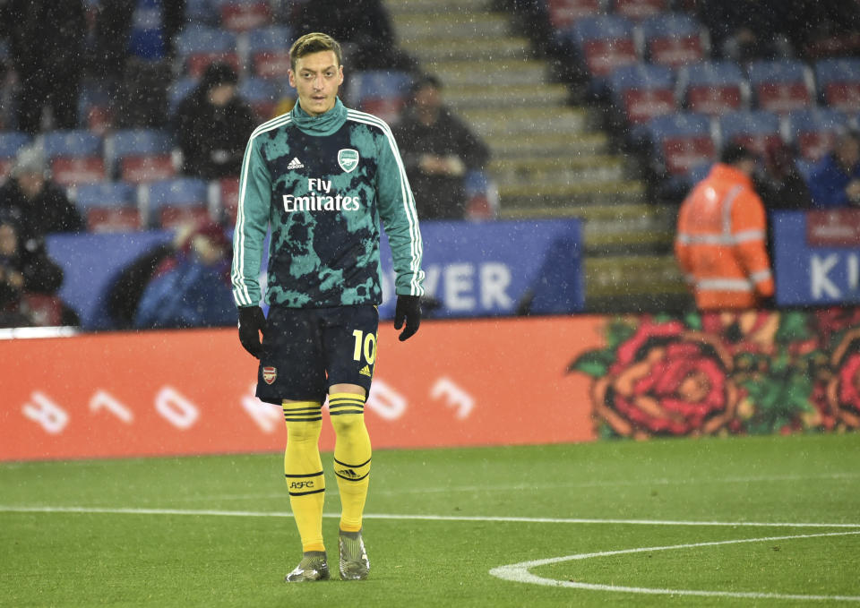 FILE - In this file photo dated Saturday, Nov. 9, 2019, Arsenal's Mesut Ozil warms up prior to the the English Premier League soccer match against Leicester City at the King Power Stadium in Leicester, England. Chinese television pulled coverage of Arsenal's Premier League match against Manchester City Sunday Dec. 15, 2019, after Mesut Ozil criticized on social media against Beijing's brutal mass crackdown on ethnic Muslims. (AP Photo/Rui Vieira, FILE)