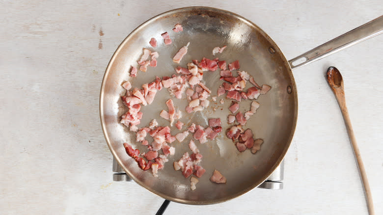 pork fat cooking in a pan