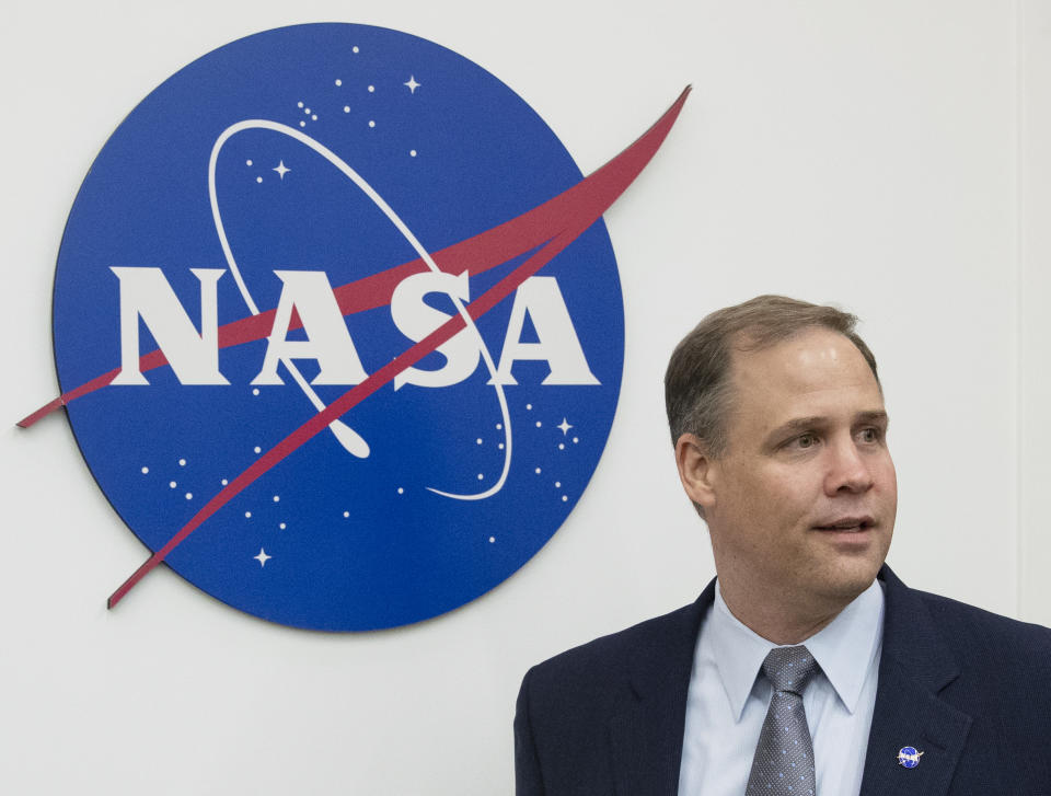 Administrator of the National Aeronautics and Space Administration (NASA) Jim Bridenstine enters the hall before a news conference at the U.S. embassy in Moscow in Moscow, Russia, Friday, Oct. 12, 2018. (AP Photo/Pavel Golovkin)