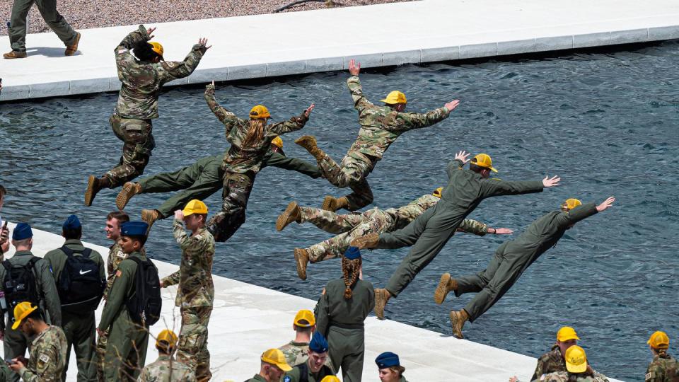 Prior to their upcoming graduation, senior Air Force Academy cadets continue the tradition of jumping into the Terazzo's Air Garden fountains to celebrate the completion of final exams at the Air Force Academy in Colorado Springs, Colo., on May 12, 2023. (Trevor Cokley/Air Force)
