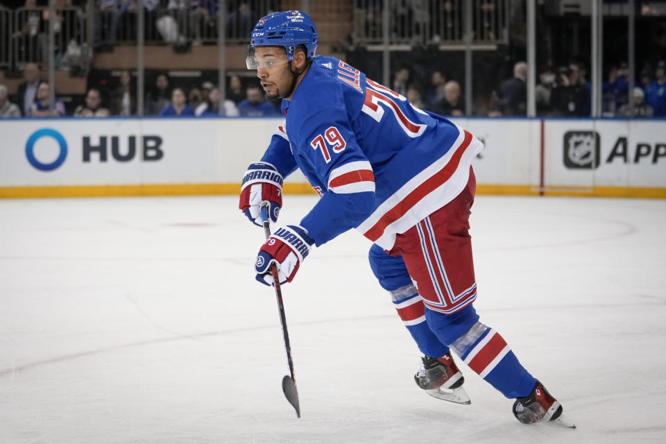 New York Rangers defenseman K'Andre Miller skates during the third period of the team's NHL hockey game against the Nashville Predators on Sunday, March 19, 2023, in New York. (AP Photo/Bryan Woolston)