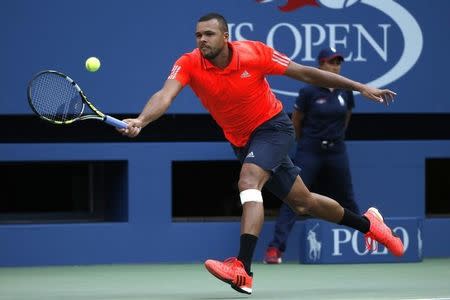 Jo-Wilfried Tsonga of France returns a shot to Marin Cilic of Croatia during their quarterfinals match at the U.S. Open Championships tennis tournament in New York, September 8, 2015. REUTERS/Mike Segar