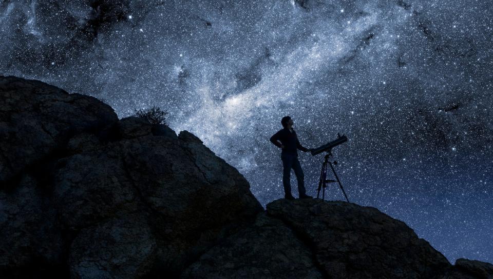 Man stargazing with a telescope