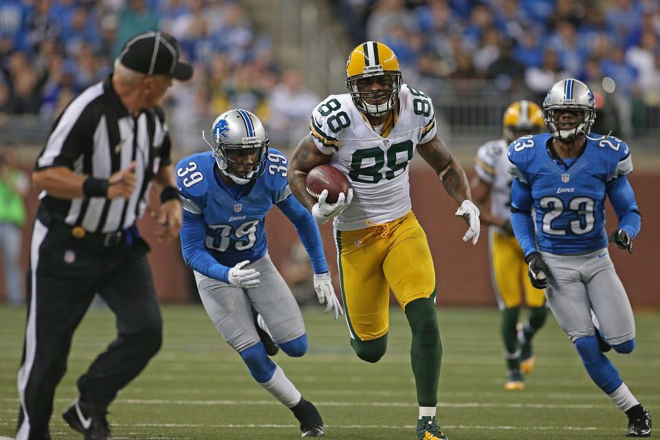 DETROIT, MI - NOVEMBER 18: Jermichael Finley #88 of the Green Bay Packers runs for a first down as Ricardo Silva #39 and Chris Houston #23 of the Detroit Lions give chase during the third quarter of the game at Ford Field on November 18, 2012 in Detroit, Michigan. The Packers defeated the Lions 24-20. (Photo by Leon Halip/Getty Images)