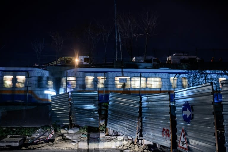 A metro passes as forensic officers work at the site of an explosion on December 1, 2015 at Bayrampasa district in Istanbul A station on the Istanbul metro was on December 1 rocked by a blast suspected to have been caused by a home-made bomb, causing panic in the evening rush hour and wounding up to half a dozen people