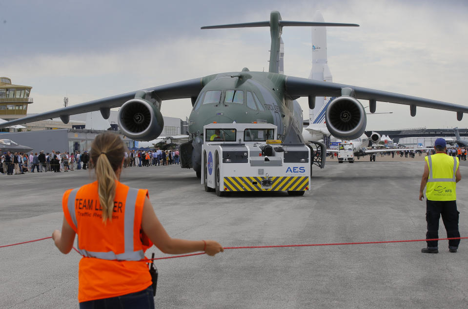 An Embraer KC-390 transport plane of the Brazilian army rolls on the tarmac at Paris Air Show, in Le Bourget, east of Paris, France, Tuesday, June 18, 2019. The world's aviation elite are gathering at the Paris Air Show with safety concerns on many minds after two crashes of the popular Boeing 737 Max. (AP Photo/Michel Euler)