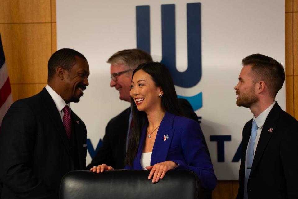 Lily Wu takes the bench after being sworn in as mayor of Wichita. Behind her are, left to right, council members Brandon Johnson, J.V. Johnston and Dalton Glasscock. Johnston and Glasscock were also sworn in on Monday evening.