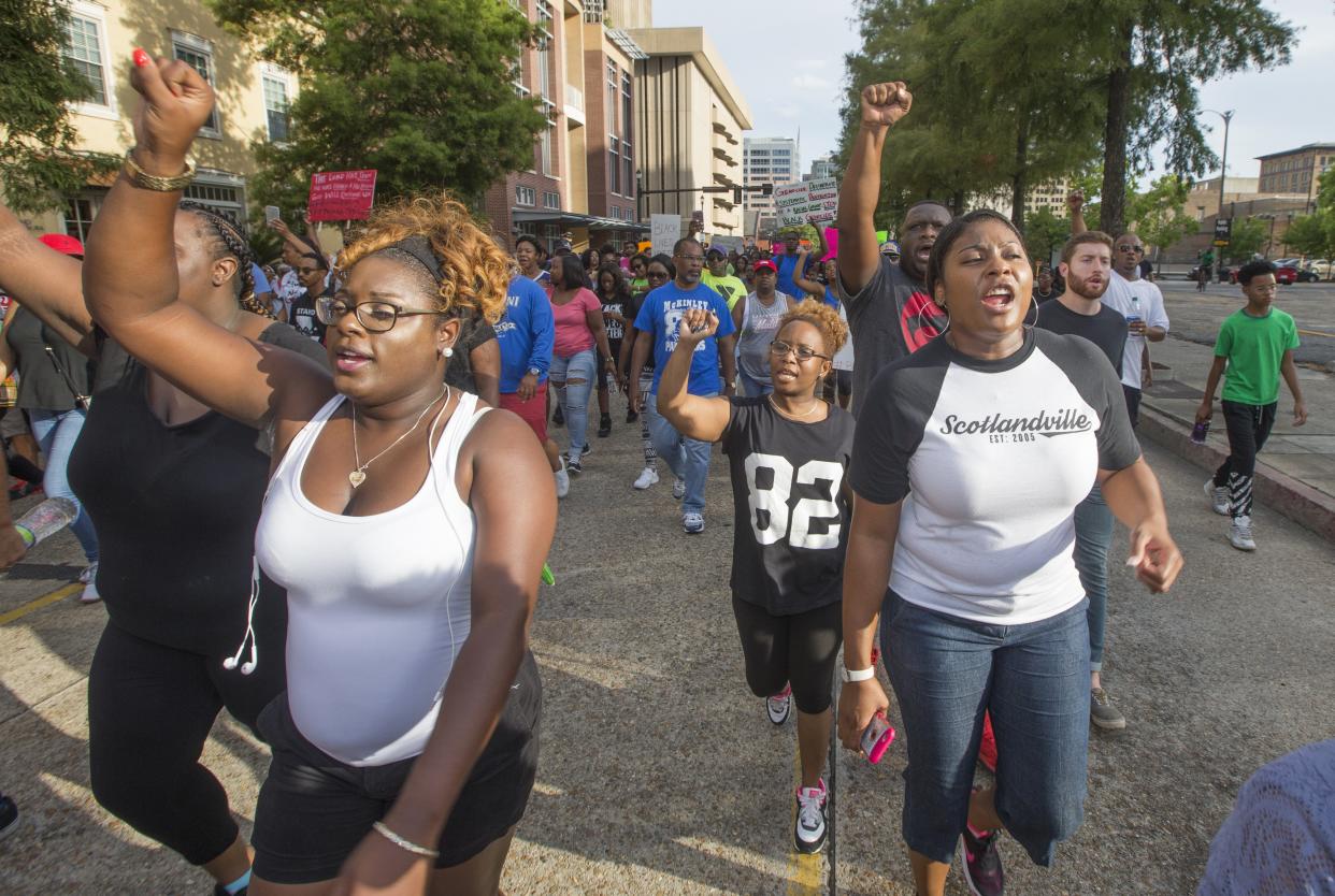 BATON ROUGE, LA - JULY 09: Protesters march from the Baton Rouge City Hall to the Louisiana Capitol to protest the shooting of Alton Sterling on July 9, 2016 in Baton Rouge, Louisiana. Alton Sterling was shot by a police officer in front of the Triple S Food Mart in Baton Rouge on July 5th, leading the Department of Justice to open a civil rights investigation. (Photo by Mark Wallheiser/Getty Images)