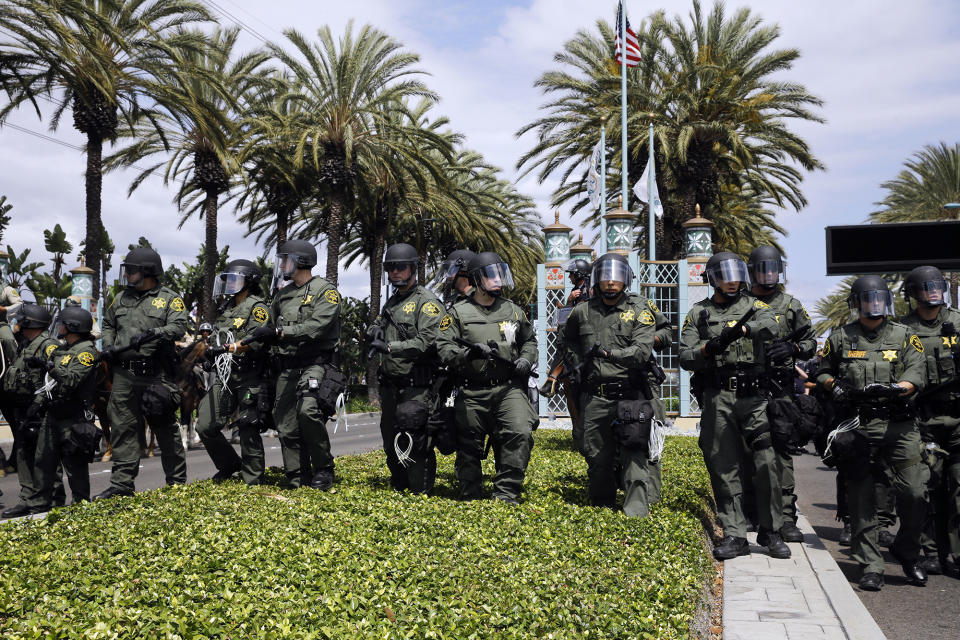 <p>Orange County Sheriff’s deputies advance forward in riot gear to disperse protesters near the Anaheim Convention Center Wednesday, May 25, 2016, in Anaheim, Calif., after Republican presidential candidate Donald Trump held a rally at the convention center. (AP Photo/Jae C. Hong) </p>