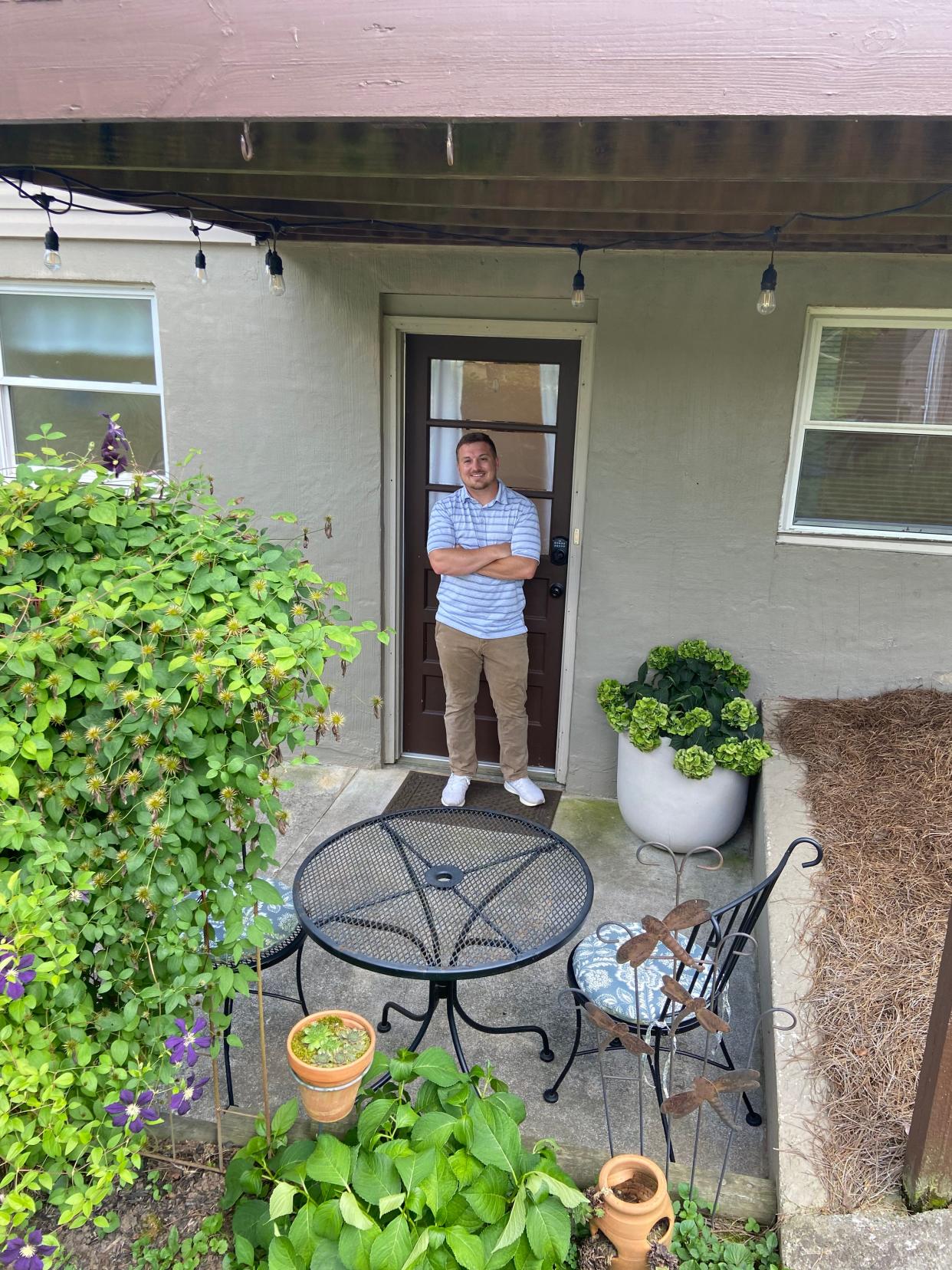 Airbnb Superhost Luke Scates, in front of his guest suite on June 22, 2022. Scates has been recognized in Airbnb’s 30 Under 30 class of 2022 with other successful hosts across the country.