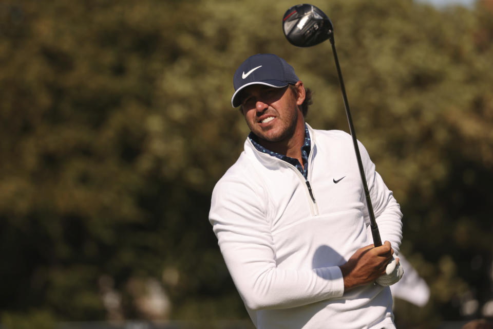 Brooks Koepka relaxes for his second big win of the year.  (AP Photo/Peter Morrison)