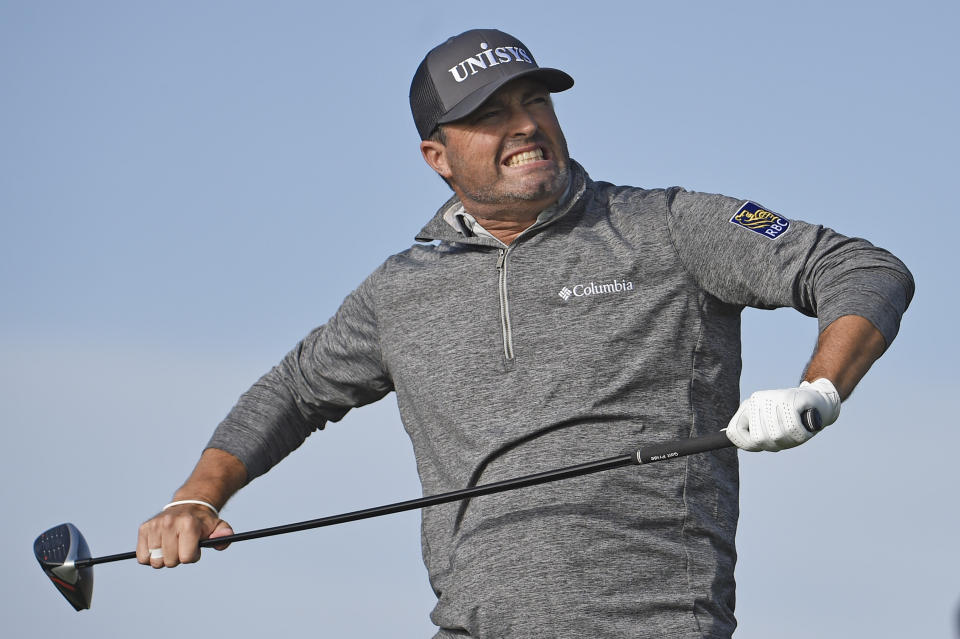 Ryan Palmer reacts after hitting his tee shot on the 18th hole of the North Course at Torrey Pines Golf Course during the second round of the Farmers Insurance golf tournament Friday, Jan. 24, 2020, in San Diego. (AP Photo/Denis Poroy)