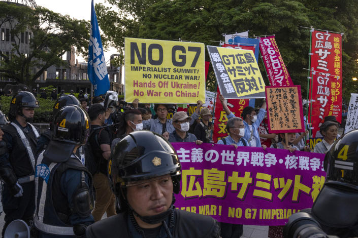 FILE - Protesters gather near the famed Atomic Bomb Dome ahead of the Group of Seven nations' meetings in Hiroshima, western Japan, Wednesday, May 17, 2023. Leaders of seven of the world’s most powerful democracies will gather this weekend for the Group of Seven summit in Hiroshima, the location of the world’s first atomic attack at the end of World War II. The leaders are expected to strongly condemn Russia’s war on Ukraine while pledging their continuing support for Ukraine. (AP Photo/Louise Delmotte, File)