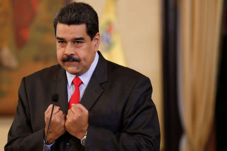 Venezuela's President Nicolas Maduro gestures as he talks to the media during a news conference in Caracas, Venezuela February 15, 2018. REUTERS/Marco Bello