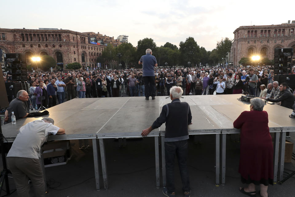 Demonstrators listen to a speaker as they gather at the Republic Square to protest against Prime Minister Nikol Pashinyan in Yerevan, Armenia, on Saturday, Sept. 30, 2023. (Hayk Baghdasaryan/Photolure via AP)
