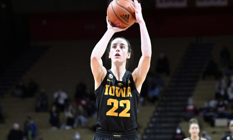 Iowa star Caitlin Clark rises up to attempt a jump shot in a game.