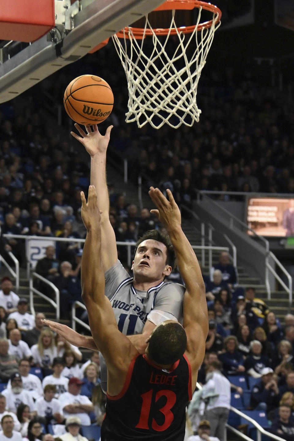 Nevada's Nick Davidson shoot against San Diego State's Jaedon LeDee during the second half of an NCAA college basketball game Friday, Feb. 9, 2024, in Reno, Nev. (AP Photo/Andy Barron)