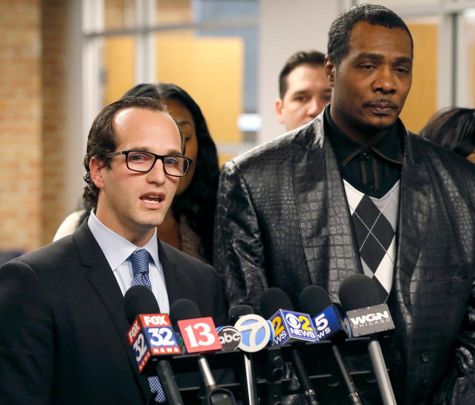 Attorney Elliot Slosar, left, flanks his client, Keith Cooper, during a news conference Friday, Feb. 10, 2017, in Chicago, after new Indiana Gov. Eric Holcomb granted him a pardon Thursday. Cooper, 49, who was released in 2006, spent more than eight years in prison for a wrongful conviction and says he's angry his name wasn't cleared by Vice President Mike Pence during his time as Indiana governor.