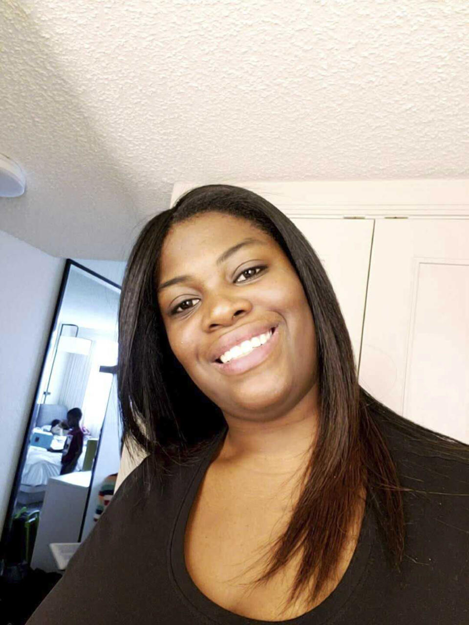 This Jan. 14, 2023, photo released by attorney Anthony D. Thomas, shows Owens, a 35-year-old mother of four from Ocala, Fla. The Marion County sheriff said Owens was shot and killed Friday, June 2, 2023, moments after going to the apartment of her neighbor, who had yelled at Owens' children as they played in a nearby lot. (Anthony D. Thomas via AP)