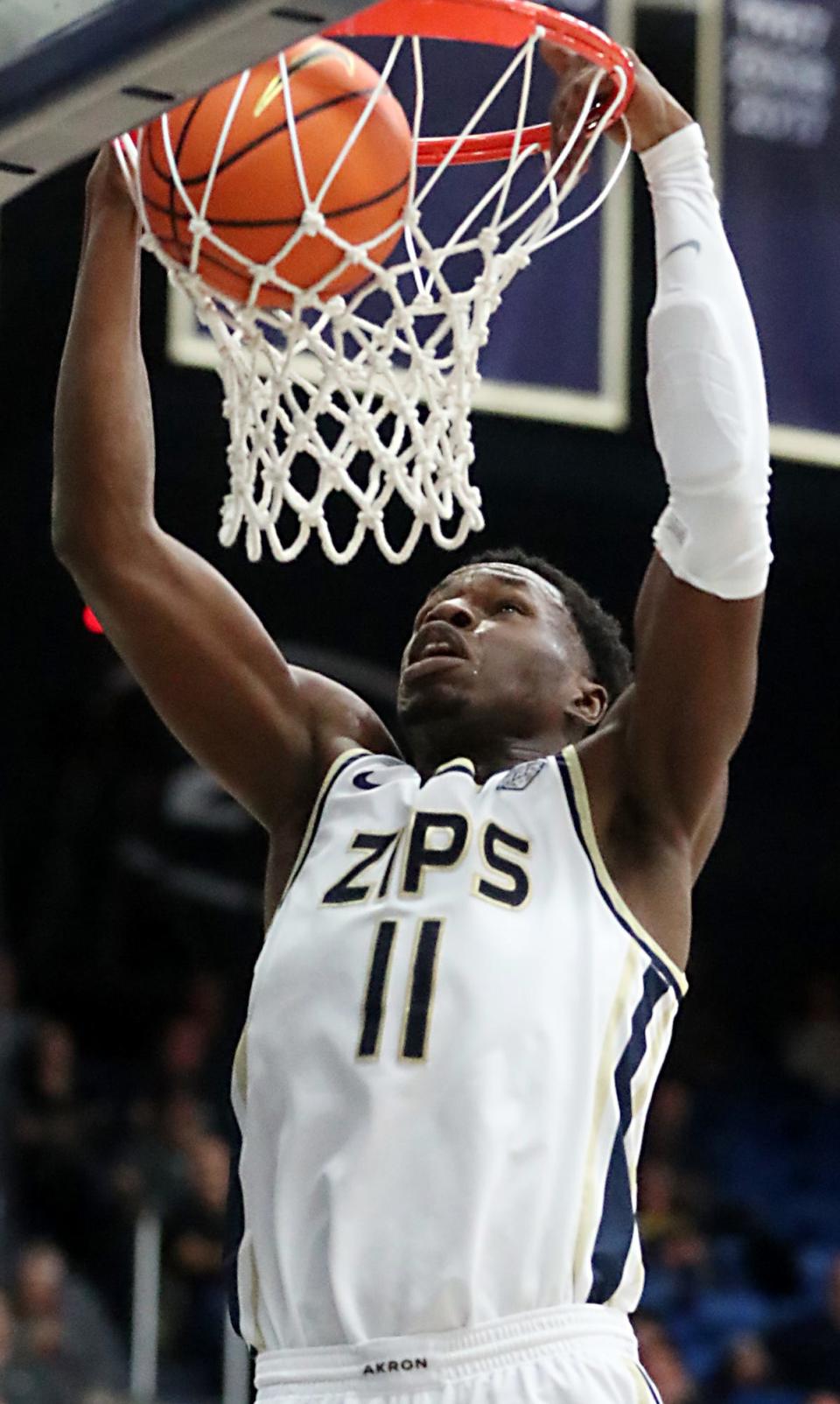 Akron's Sammy Hunter dunks against Eastern Michigan University during their MAC game at the University of Akron's James A. Rhodes Arena on Friday. The Zips beat the Eagles 104 to 67.